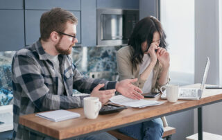 Couple in their kitchen feeling contempt in their relationship