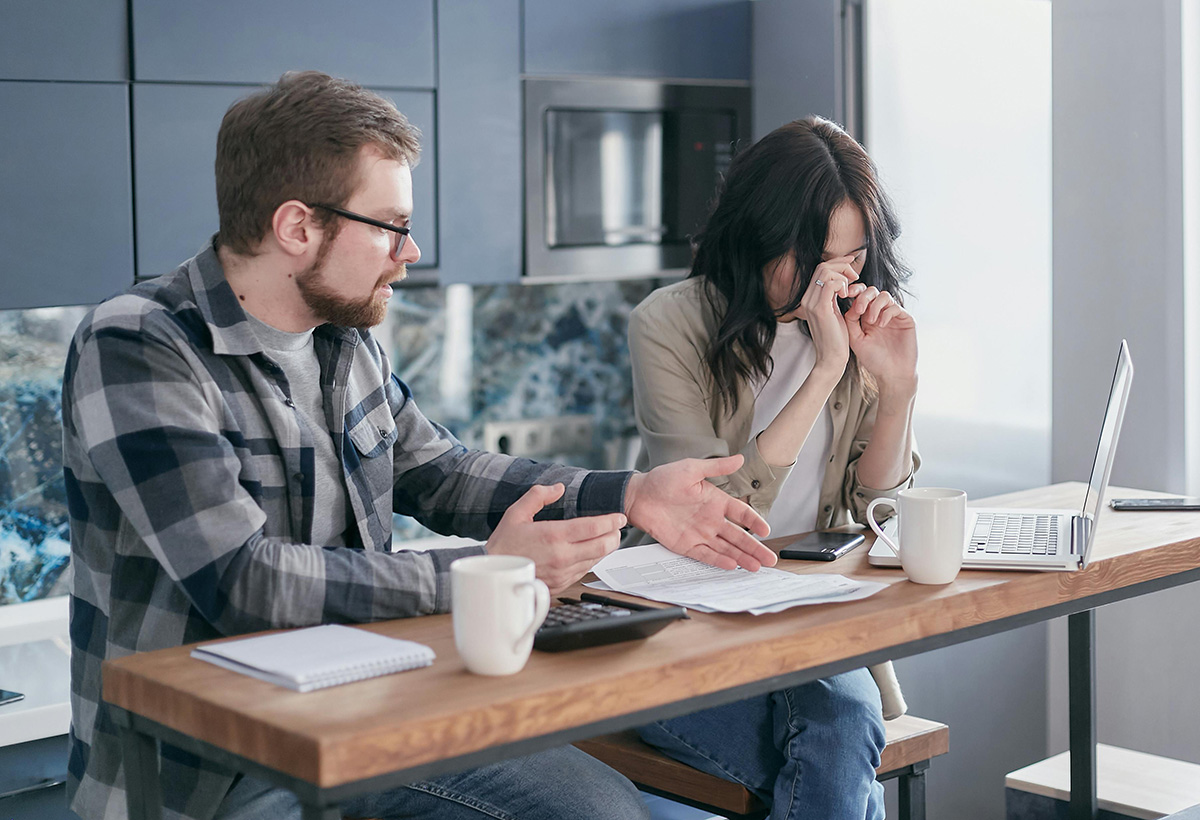 Couple in their kitchen feeling contempt in their relationship