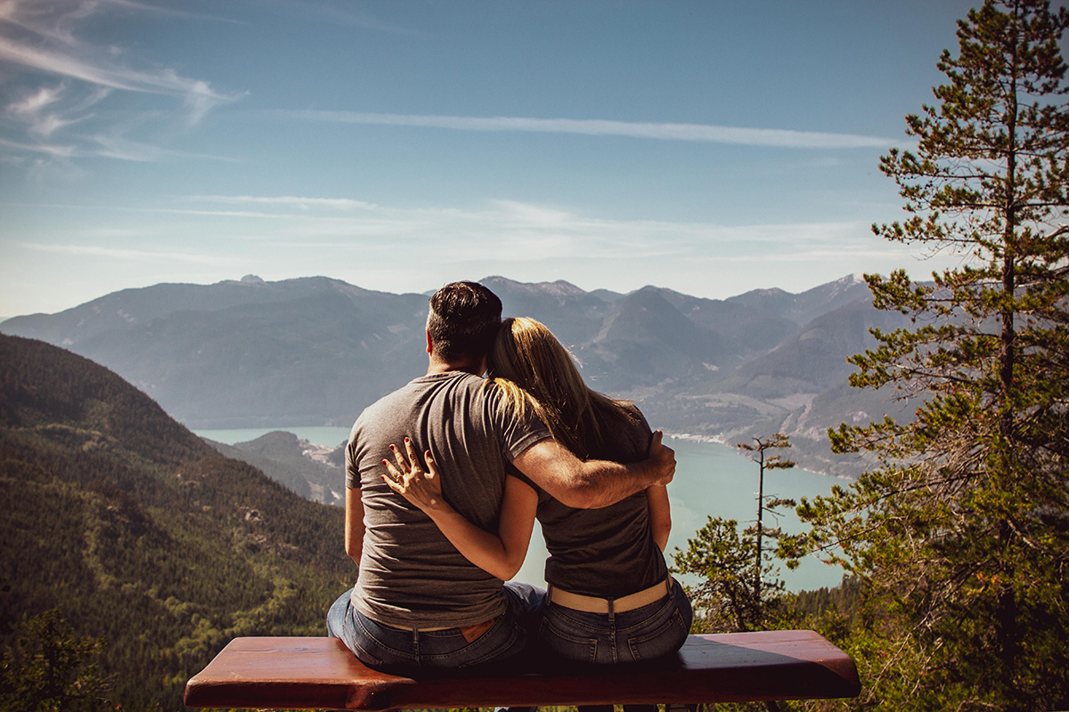 Happy couple on a mountaintop